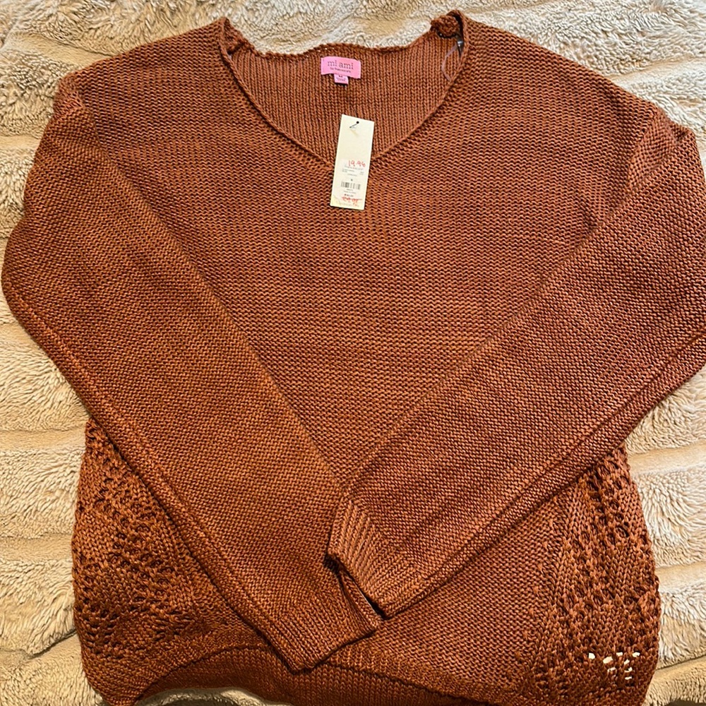 Brand new with tags sweater from Francesca’s . It’s a size medium.